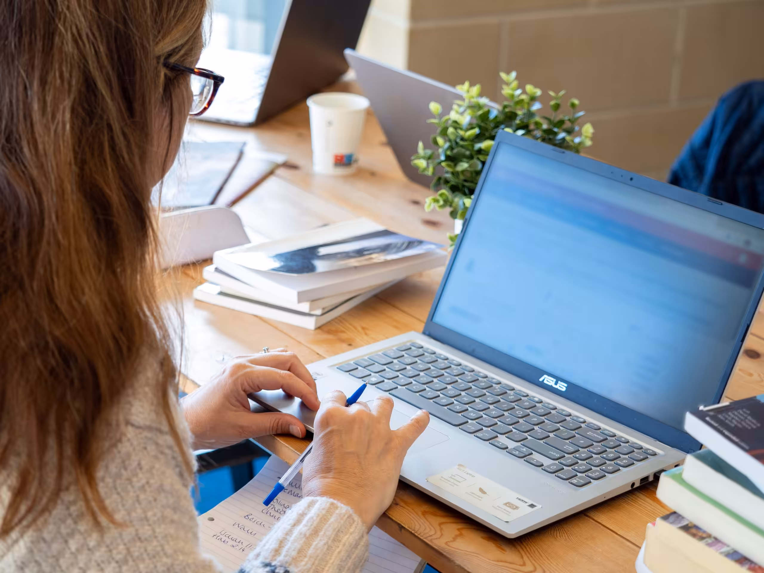 A person typing on a laptop computer