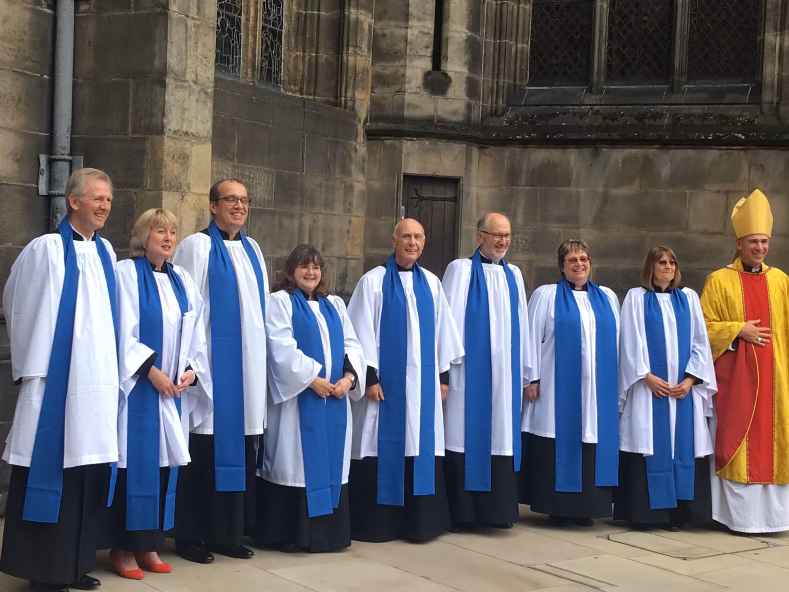 Lay Readers in a line outside the cathedral with the bishop